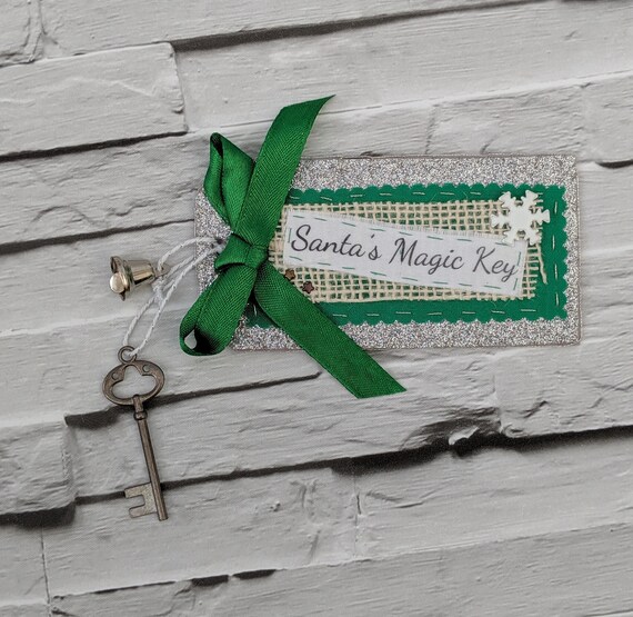 Santa's Magic Key. Magic Key for Santa Claus with a Silver glitter tag and green ribbon. Santa's Magic Key. Magic Key for Santa Claus with a Silver glitter tag and green ribbon.