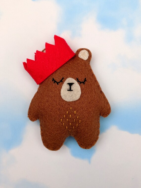 Festive Bear Christmas Ornament. Cute Felt Brown Bear with a red Christmas Crown. Festive Bear Christmas Ornament. Cute Felt Brown Bear with a red Christmas Crown.