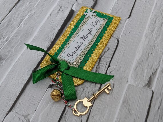 Santa's Magic Key. Magic Key for Santa Claus with a Gold glitter tag and green ribbon. Santa's Magic Key. Magic Key for Santa Claus with a Gold glitter tag and green ribbon.