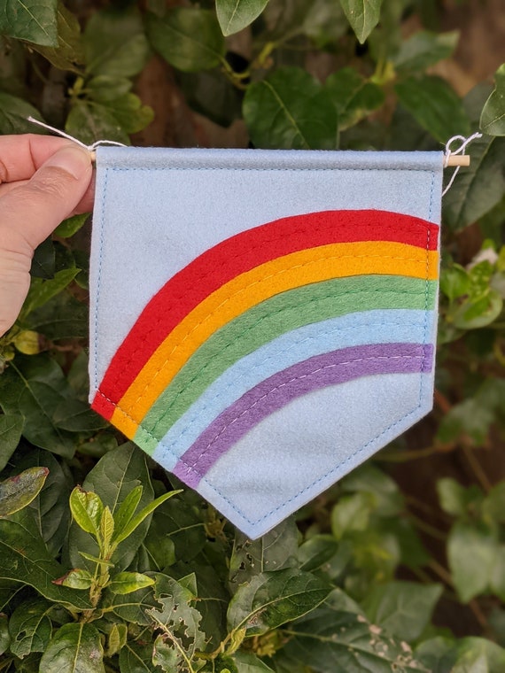 Rainbow Pennant Flag. Kids Bedroom Art. Playroom Wall Hanging. Nursery Decor. Rainbow Gift. Customisable Felt Banner. Rainbow Pennant Flag. Kids Bedroom Art. Playroom Wall Hanging. Nursery Decor. Rainbow Gift. Customisable Felt Banner.