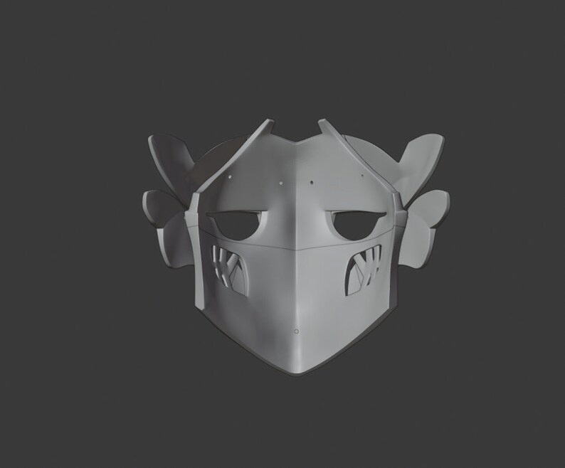 May include: A gray 3D printed helmet with a face mask and two small horns on the sides.