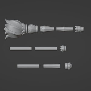 May include: A 3D printed model of a decorative scepter, broken down into its individual parts. The scepter features a lotus flower design at the top and a pointed tip at the bottom.