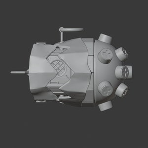 May include: A gray, 3D-printed model of a futuristic, mechanical device with a round, segmented body and multiple protruding knobs. The device has a textured surface and appears to be made of metal.