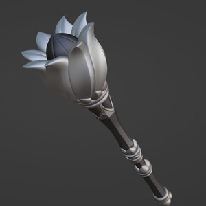 May include: A silver and black ceremonial staff with a lotus flower design at the top. The staff has a black handle with silver accents.