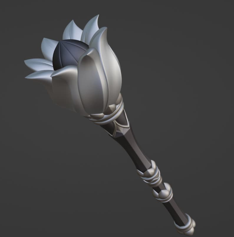 May include: A silver and black ceremonial staff with a lotus flower design at the top. The staff has a black handle with silver accents.