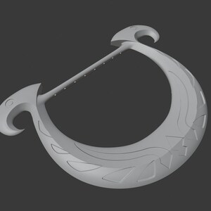 May include: A light grey, crescent-shaped object with a long, straight handle dotted with small circles. The crescent features decorative wave and triangle patterns, and ends in a curved hook shape.