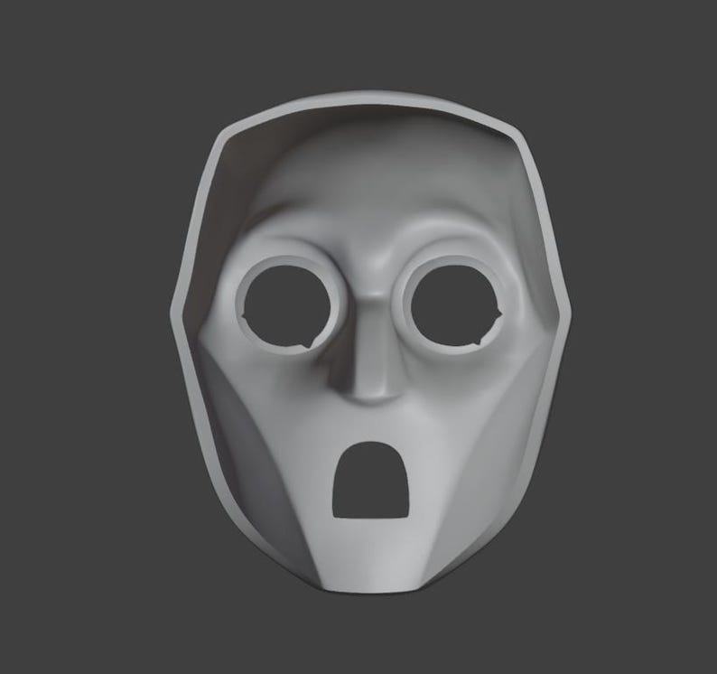 Op de afbeelding: Een grijs plastic masker met twee ooggaten en een mondgat. Het masker heeft een eenvoudig ontwerp en doet denken aan een robot of een alien.