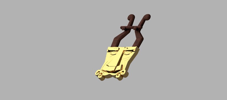May include: A gold-colored pendant featuring a stylized face with prominent eyes and a nose, attached to two dark brown, curved, horn-like extensions at the top and small decorative scrolls at the bottom base.