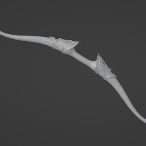May include: A white, wooden bow with intricate carvings and a curved design. The bow is made of a smooth, polished wood and has a natural finish.