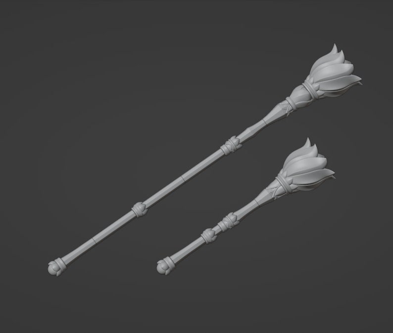 May include: Two silver-colored scepters with a flower-shaped top. The scepters are made of metal and have a smooth, polished finish.