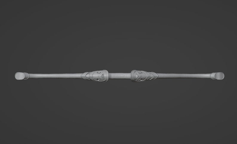 May include: A silver-colored, decorative, double-ended staff with intricate carvings on each end.