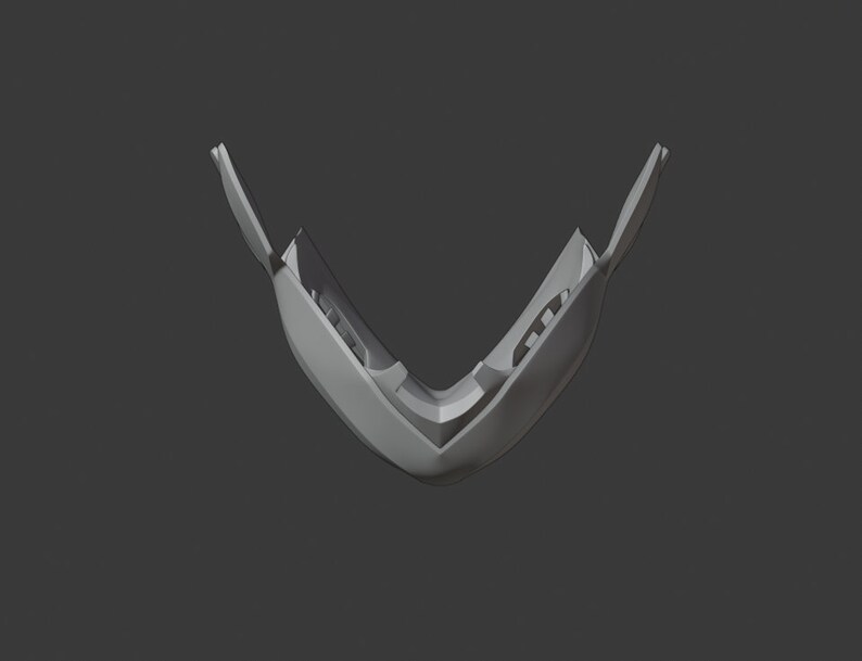May include: A white plastic mouthguard with a V-shaped design. The mouthguard is open and shows the inside of the guard.