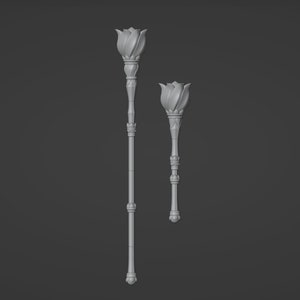 May include: Two decorative flower-shaped scepters, one larger than the other, with a silver finish.