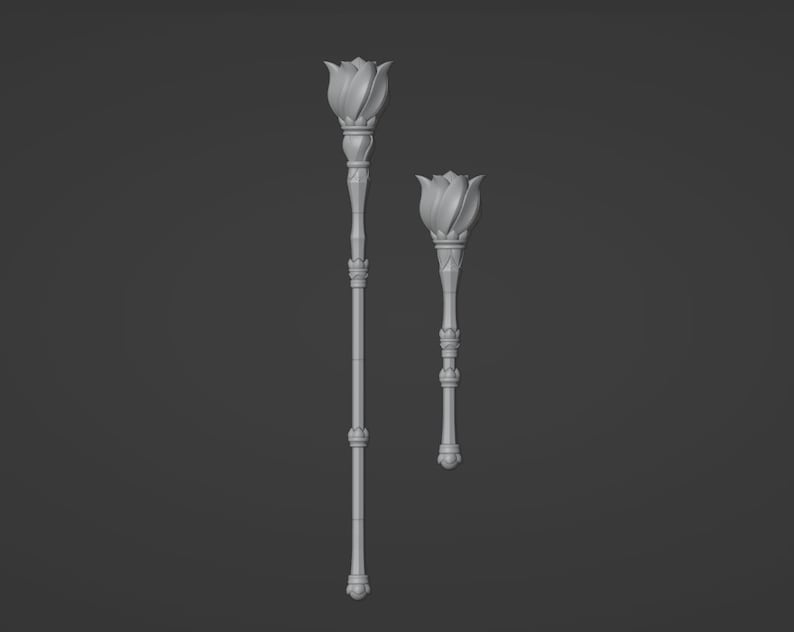 May include: Two decorative flower-shaped scepters, one larger than the other, with a silver finish.