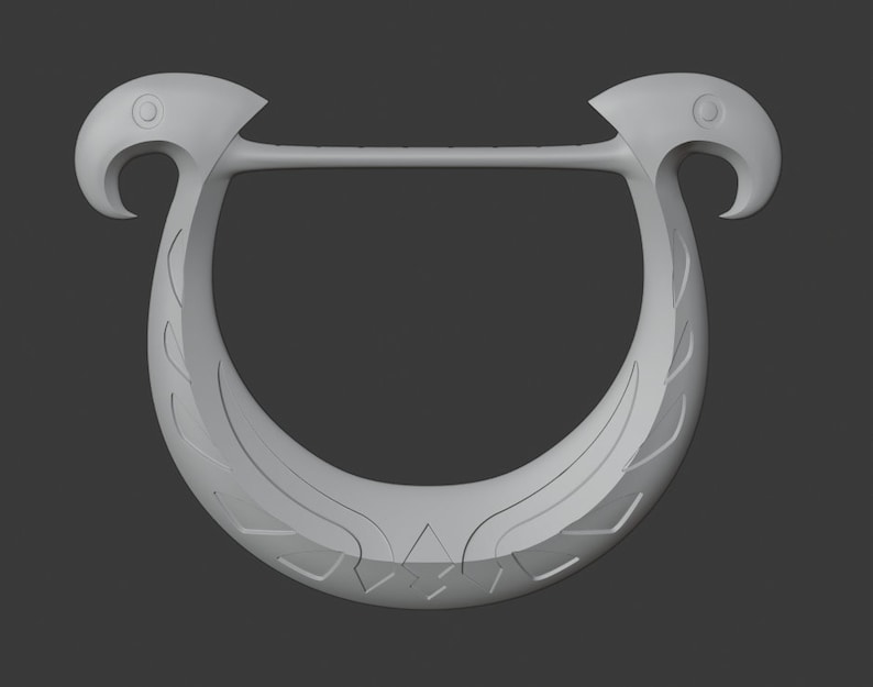 May include: A light grey, U-shaped decorative object with bird-like heads at each end. The object has a curved design with etched details, and a straight bar connecting the bird heads. The background is a solid grey.