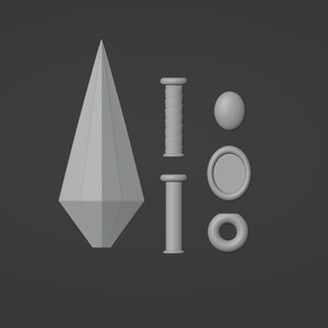 Puede incluir: Un conjunto de cinco objetos impresos en 3D, que incluyen una lanza puntiaguda, dos piezas cil&iacute;ndricas, un anillo y un disco redondo.