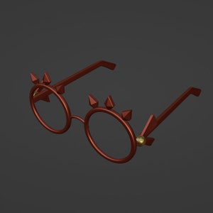 Op de afbeelding: Een paar ronde, roodbruine brillen met gouden accenten. De brillen hebben een uniek ontwerp met spikes rond de frames.