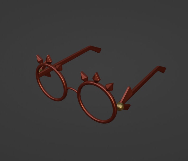 Op de afbeelding: Een paar ronde, roodbruine brillen met gouden accenten. De brillen hebben een uniek ontwerp met spikes rond de frames.