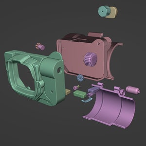 May include: A disassembled 3D printed model of a camera. The model is made up of several parts, including a body, lens, and a viewfinder. The parts are in various shades of green, purple, and brown.