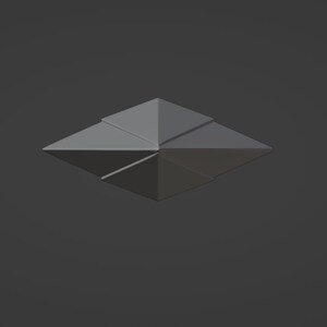 Puede incluir: Una estrella de origami gris con ocho puntas, doblada de una sola hoja de papel.