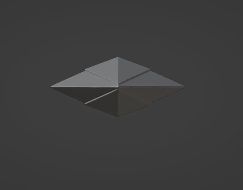 Puede incluir: Una estrella de origami gris con ocho puntas, doblada de una sola hoja de papel.