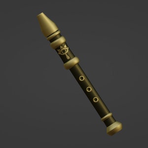 May include: A gold and black flute with a stylized eye design. The flute has six holes and a gold mouthpiece.