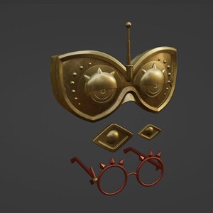 Op de afbeelding: Een goudkleurig, futuristisch ogend oogmasker met een kleine antenne bovenop. Het masker heeft twee grote, ronde lenzen met ingewikkelde details. Er zijn ook twee kleinere, ruitvormige stukken met gouden accenten. Het masker wordt vergezeld door een paar rode brillen met gouden accenten en spikes.