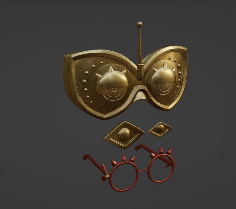 Op de afbeelding: Een goudkleurig, futuristisch ogend oogmasker met een kleine antenne bovenop. Het masker heeft twee grote, ronde lenzen met ingewikkelde details. Er zijn ook twee kleinere, ruitvormige stukken met gouden accenten. Het masker wordt vergezeld door een paar rode brillen met gouden accenten en spikes.