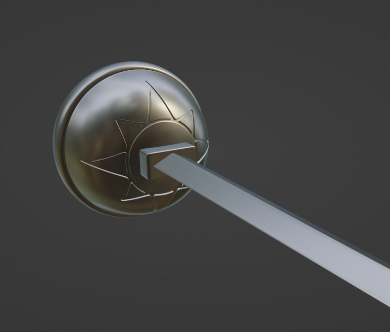 May include: A metallic, circular, dome-shaped object featuring an embossed star-like design with multiple points. A rectangular-based, straight, elongated rod extends outward from the center of the dome, creating a distinct geometric profile.