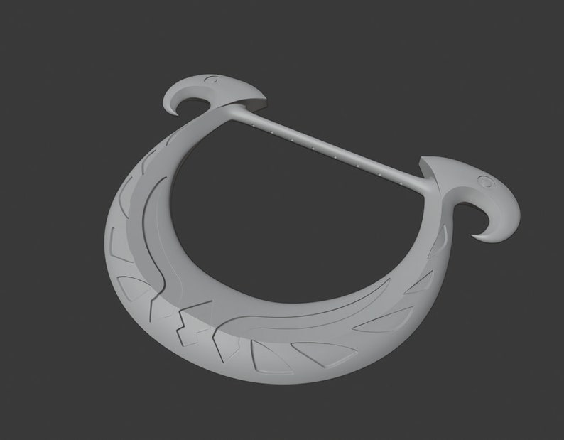 May include: A light grey, crescent-shaped object with a straight handle. The curved section has etched designs, and the ends have bird-like shapes. The object is set against a dark grey background.