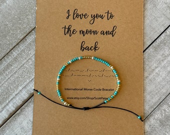 Pulsera turquesa con código Morse: "Te amo hasta la luna y más allá"