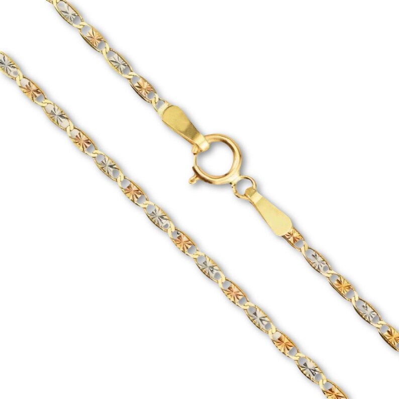 A 14K tri-color Valentino chain photographed on a plain background, clearly displaying the classic 1.5mm link pattern and luxurious gold tones.