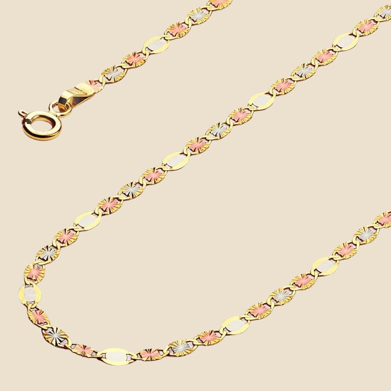 A stunning 14K solid gold Valentino chain necklace displayed on a clean, plain background. This elegant 2mm chain features a polished finish, reflecting light beautifully. Crafted in Italy, the delicate yet durable design makes it perfect for layering or wearing solo. Available in lengths from 16 to 24 inches, with a secure spring ring clasp for a comfortable fit.