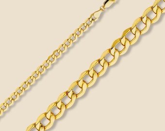 May include: A gold chain necklace with a curb link style. The chain is shown laid out flat on a light beige background.