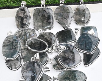 May include: A collection of 14 silver pendant charms featuring moss agate stones. The stones are a mix of green, gray, and black with a swirling pattern. The pendants are all different shapes and sizes.