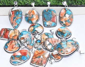May include: A collection of 12 turquoise and coral gemstone pendants with silver settings. The pendants are various shapes and sizes, including oval, teardrop, and rectangular.