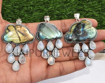 May include: Three silver pendants with labradorite gemstone clouds and moonstone raindrops. Each pendant features a different color of labradorite.