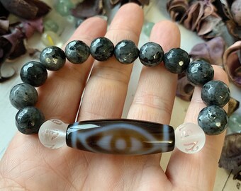 Amulet of wealth and protection.Luck bracelet of Bead Dzi a vessel of abundance and 10mm sardonyx lava beads.Magic bracelet of gemstones.