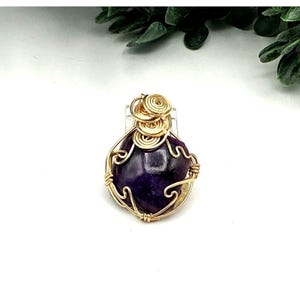 Handcrafted Amethyst Gemstone Wire-Wrapped Pendant With Gold-Tone Artistic Spiral Design