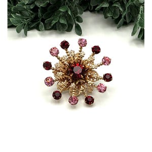 Vintage Gold-Tone Sunburst Brooch With Red and Pink Rhinestones