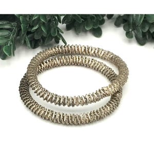 Set Of 2 Silver Tone Textured Coil Stretch Bracelets