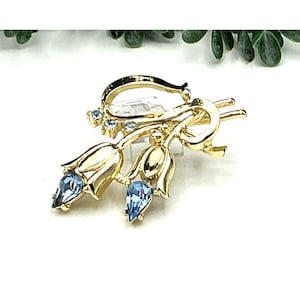 Gold Tone Floral Brooch With Blue Gem Accents