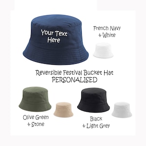 May include: Reversible bucket hat with personalised text. The hat is shown in French Navy and White, Olive Green and Stone, and Black and Light Grey.