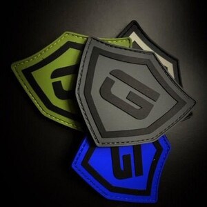 May include: A handmade wooden sign with the text "Welcome to our home" in a handwritten style. The sign is painted white with a dark stained wooden frame. A small, decorative heart is attached to the sign.