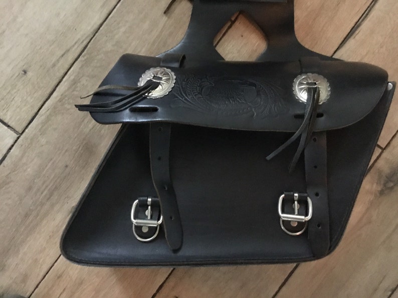 Tooled leather motorcycle side bags with metal detail