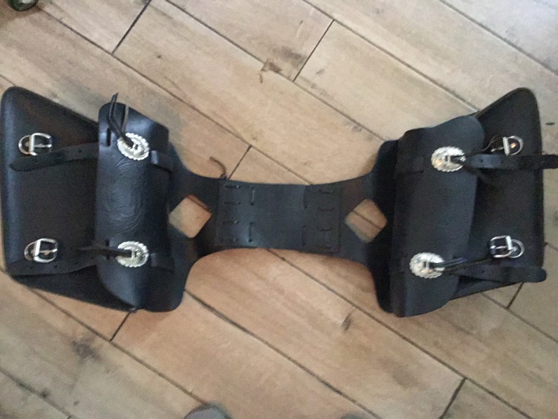 Tooled leather motorcycle side bags with metal detail