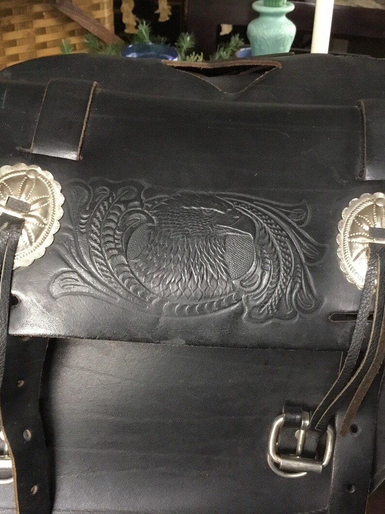 Tooled leather motorcycle side bags with metal detail