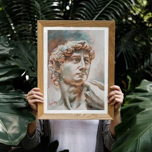 Könnte beinhalten: Ein gerahmtes Aquarellbild einer Skulptur eines Männerkopfes und -schulterbereichs. Die Skulptur ist in Braun-, Beige- und Weißtönen gemalt. Das Bild ist in einem hellbraunen Holzrahmen gerahmt.