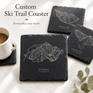 May include: Square black slate coasters featuring laser-engraved white ski trail maps of Breckenridge, Jackson Hole, and Killington. The text reads Custom Ski Trail Coaster, Personalize any resort, Breckenridge Colorado, Jackson Hole Wyoming, and Killington Vermont.