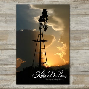 Storm cloud sunset frames an old windmill at Copper Breaks SP. Warm colors perfect for country home, ranch, cabin or modern farmhouse décor.